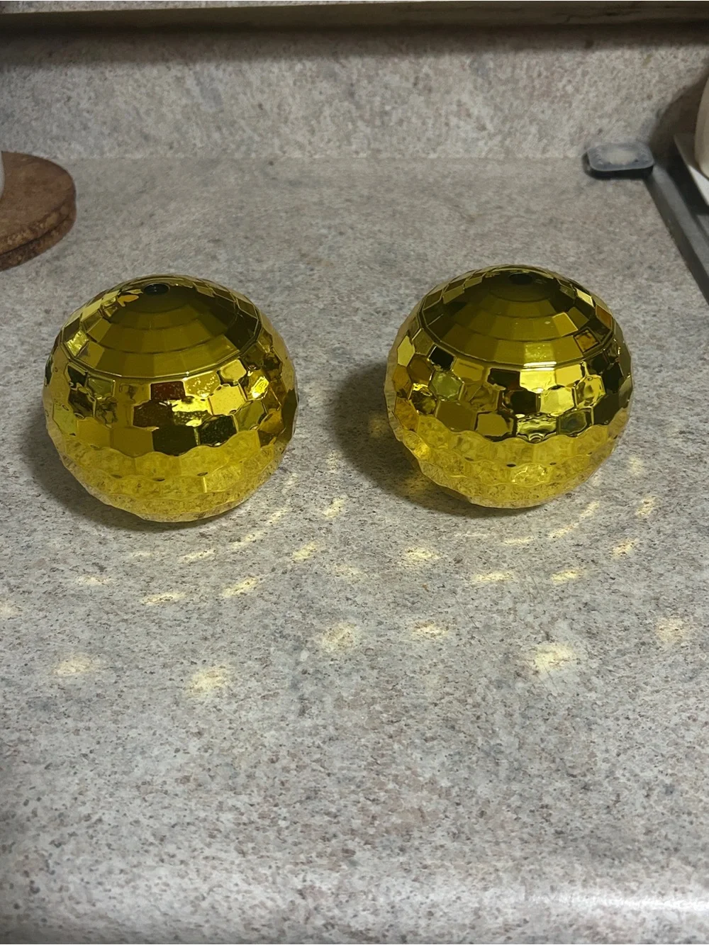 A set of 2 gold disco cups